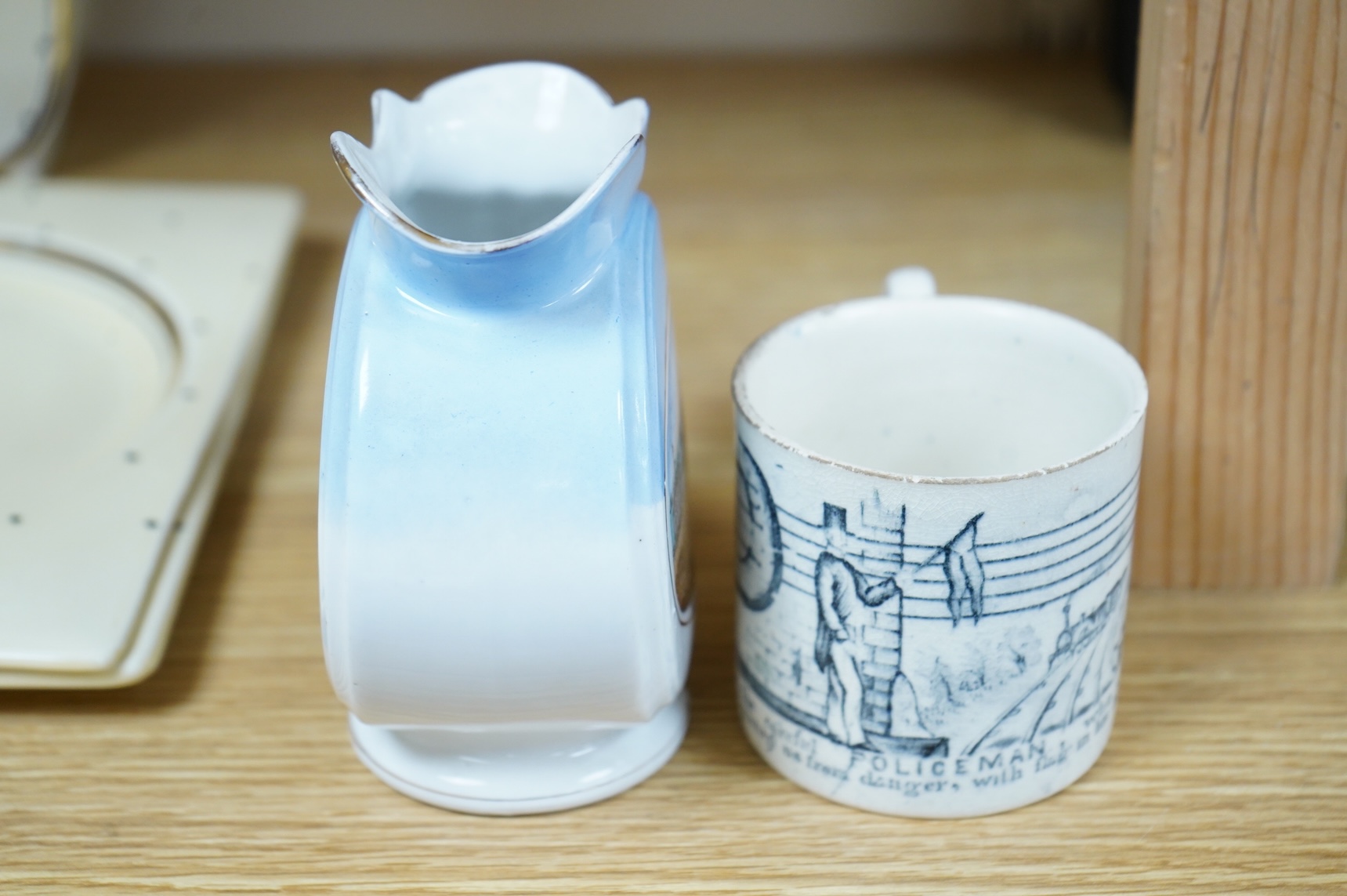 A 19th century Policeman mug and an early 20th century Brighton West Pier jug, 13cm